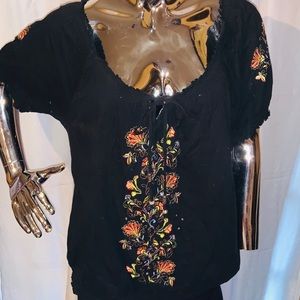 Black top with floral designs